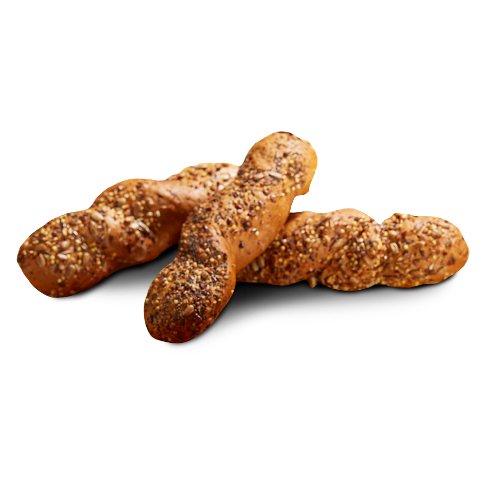 Drei goldbraun gebackene glutenfreie Körnerstangen, bedeckt mit Saaten