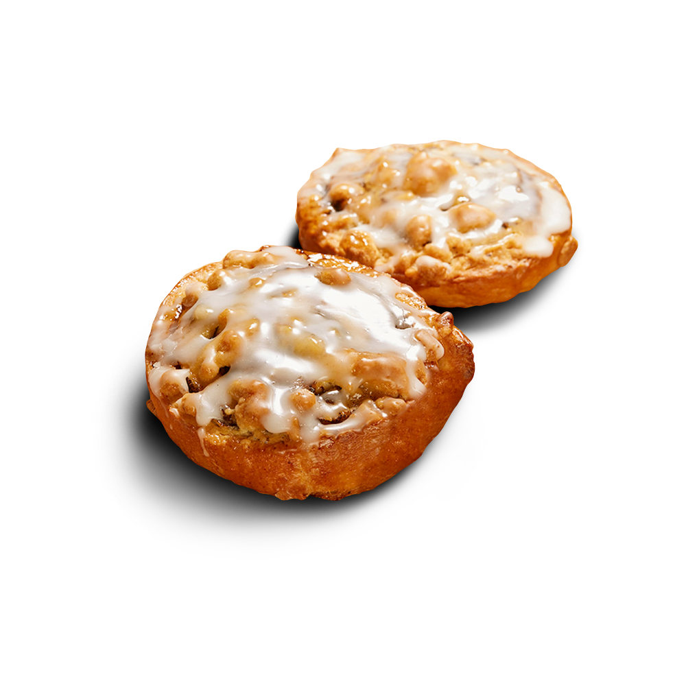 Zwei glutenfreie runde Mohnschnecken mit sichtbarer Mohnfüllung, Butterstreuseln und Zuckergussglasur